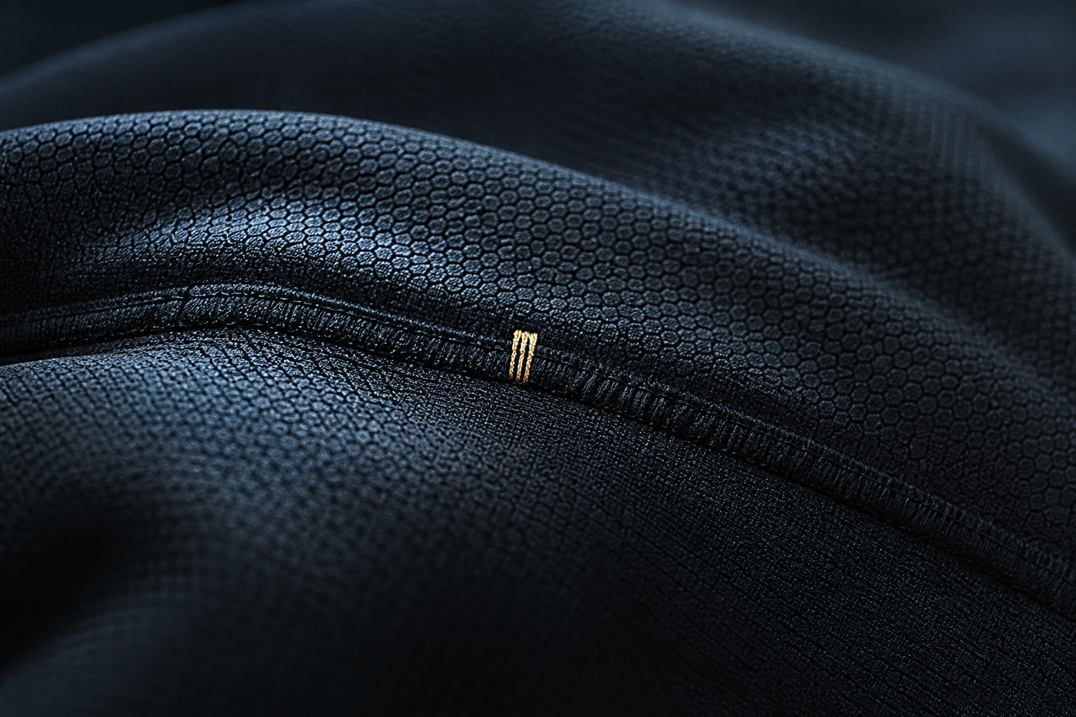 Carbon micro-hex knit with gold bartack
